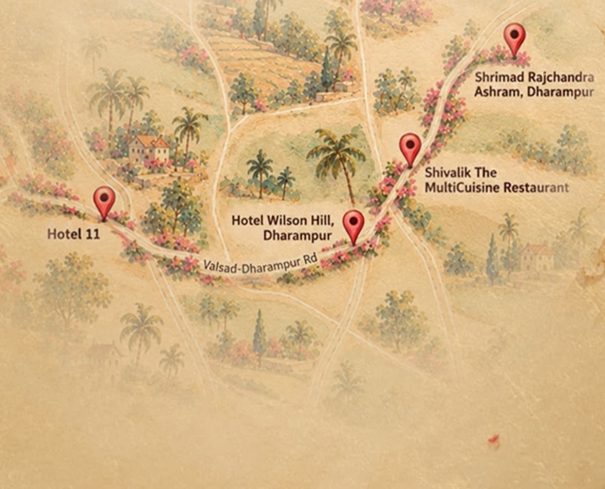 A hand-painted map of Dharampur showing Hotel 11, Hotel Wilson Hill, Shivalik restaurant and the Shrimad Rajchandra Ashram along the Valsad–Dharampur road